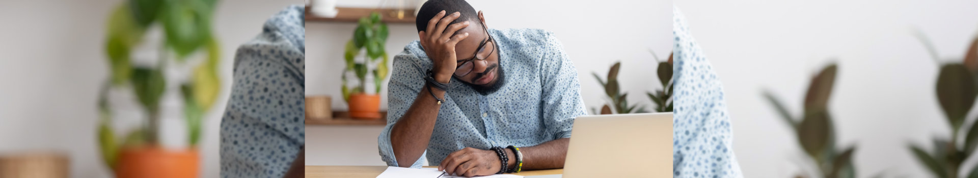 Tired depressed bored african businessman frustrated by business failure bankruptcy looking at laptop feel exhausted having headache, upset stressed black office worker worried about problem at work