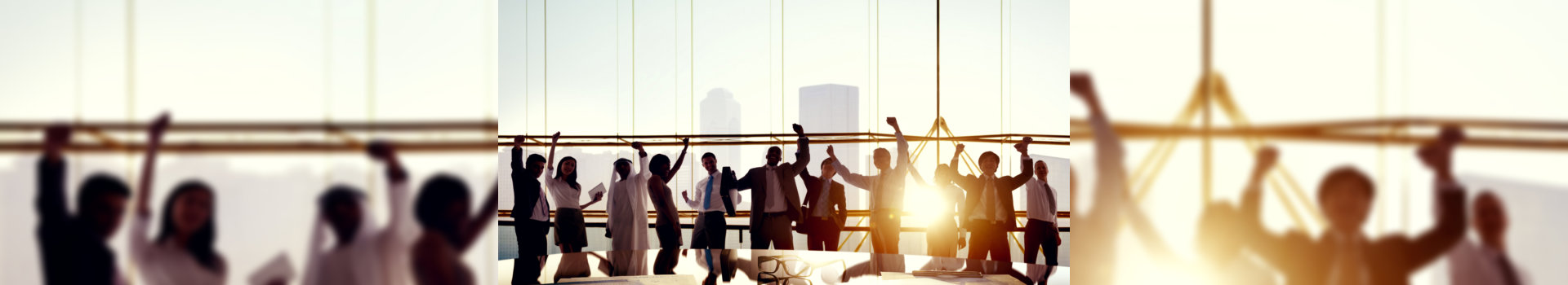 Business Team Celebrating in Board Room.